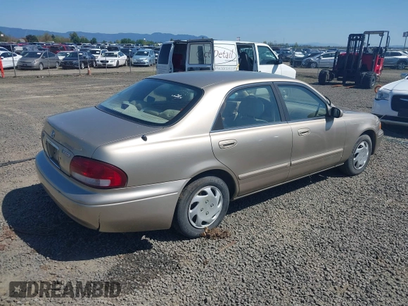 1999 Mazda 626 ES z VIN 1YVGF22C5X5811946, wystawiony jako IAAI lot #41970165 z przebiegiem 126 709 mil mil oraz . Historia ofert i sprzedaży dostępna na DreamBid. Obrazek 4.