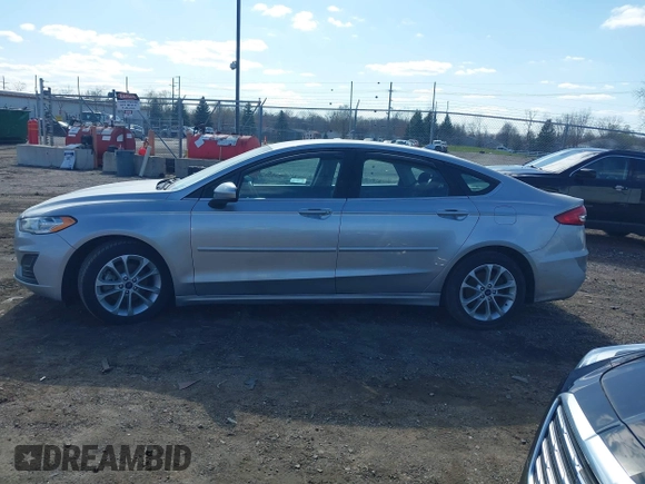 2020 Ford Fusion SE z VIN 3FA6P0LU8LR163896, wystawiony jako IAAI lot #41994803 z przebiegiem 89 892 mil mil oraz . Historia ofert i sprzedaży dostępna na DreamBid. Obrazek 14.