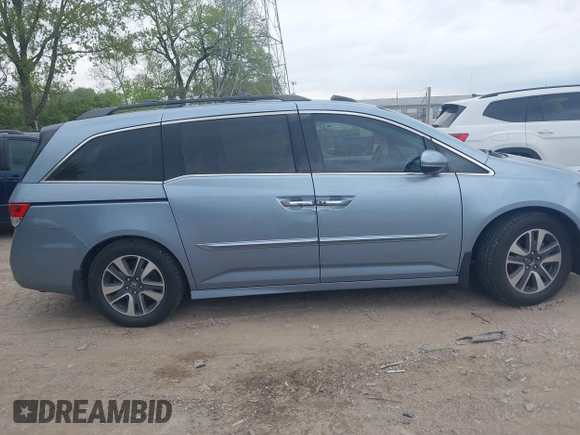 2014 Honda Odyssey Touring with VIN 5FNRL5H91EB081811, listed as a IAAI auction lot 42153920 with 16 mi miles and . Bid and sale history available at DreamBid. Image 13.