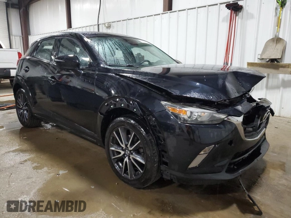 2018 Mazda CX-3 Touring z VIN JM1DKFC75J0301307, wystawiony jako Copart lot #56302175 z przebiegiem 107 676 mil mil oraz Szkoda całkowita • Salvage title. Historia ofert i sprzedaży dostępna na DreamBid. Obrazek 4.