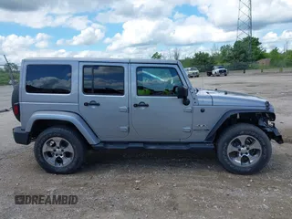 2018 Jeep Wrangler Unlimited Sahara with VIN 1C4BJWEGXJL806832, listed as a IAAI auction lot 42605892 with 90,535 mi miles and . Bid and sale history available at DreamBid. Image 13.