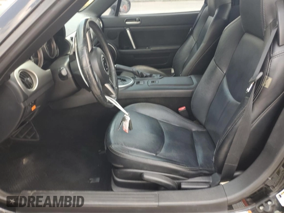 2009 Mazda MX-5 Miata Grand Touring with VIN JM1NC26F390204924, listed as a Copart auction lot 63492955 with 215,707 mi miles and Salvage title. Bid and sale history available at DreamBid. Image 7.