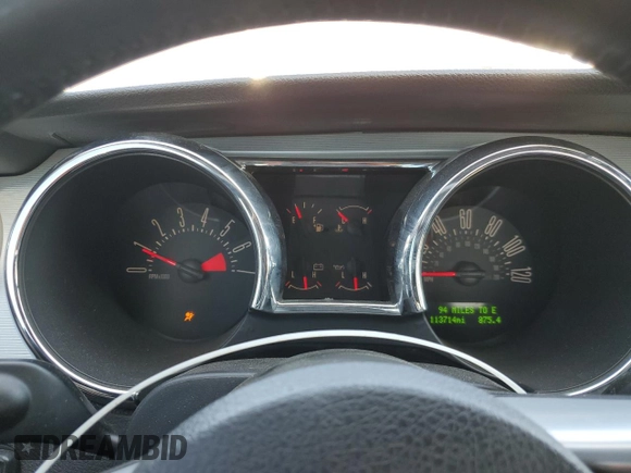 2007 Ford Mustang Deluxe z VIN 1ZVFT80NX75222261, wystawiony jako Copart lot #56236045 z przebiegiem 113 714 mil mil oraz Szkoda całkowita • Salvage title. Historia ofert i sprzedaży dostępna na DreamBid. Obrazek 9.