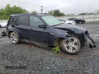 2011 BMW X5 M z VIN 5YMGY0C52BLK26824, wystawiony jako Copart lot #57847845 z przebiegiem 144 217 mil mil oraz Szkoda całkowita • Salvage title. Historia ofert i sprzedaży dostępna na DreamBid. Obrazek 4.