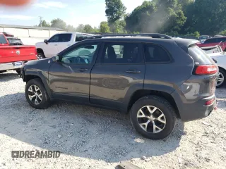 2014 Jeep Cherokee Trailhawk with VIN 1C4PJMBS1EW304718, listed as a Copart auction lot 64105485 with 151,315 mi miles and Salvage title. Bid and sale history available at DreamBid. Image 2.