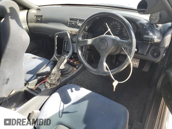 1990 Nissan Skyline z VIN BNR32010431, wystawiony jako Copart lot #78496994 z przebiegiem 182 401 mil mil oraz Nie do naprawy • Non repairable. Historia ofert i sprzedaży dostępna na DreamBid. Obrazek 8.