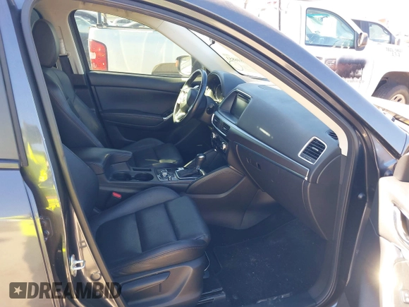2016 Mazda CX-5 Grand Touring with VIN JM3KE2DYXG0784615, listed as a IAAI auction lot 41846853 with 72,185 mi miles. Bid and sale history available at carsss.com. Image 5.