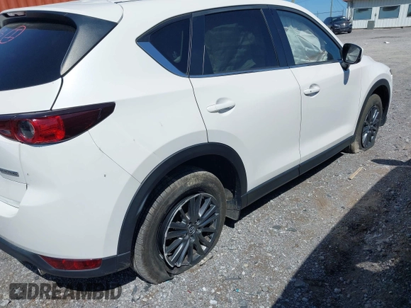 2021 Mazda CX-5 Touring z VIN JM3KFBCM2M1395663, wystawiony jako IAAI lot #41948073 z przebiegiem 47 029 mil mil oraz . Historia ofert i sprzedaży dostępna na DreamBid. Obrazek 6.