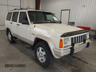 1996 Jeep Cherokee z VIN 1J4FT78S5TL232090, wystawiony jako IAAI lot #42267272 z przebiegiem 255 417 mil mil oraz . Historia ofert i sprzedaży dostępna na DreamBid. Obrazek 1.