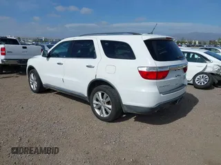 2013 Dodge Durango Crew with VIN 1C4SDHDT2DC679600, listed as a IAAI auction lot 42215737 with 128,499 mi miles and . Bid and sale history available at DreamBid. Image 3.