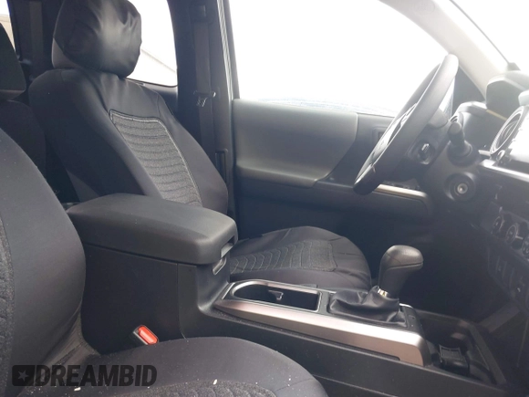 2023 Toyota Tacoma SR with VIN 3TYRX5GNXPT069128, listed as a IAAI auction lot 42007435 with 18,000 mi miles and . Bid and sale history available at DreamBid. Image 5.