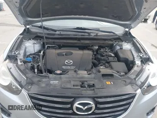 2016 Mazda CX-5 Grand Touring with VIN JM3KE2DY9G0723921, listed as a IAAI auction lot 41681522 with 83,893 mi miles. Bid and sale history available at carsss.com. Image 10.