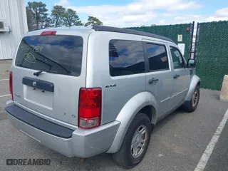2011 Dodge Nitro SE with VIN 1D4PU2GKXBW508467, listed as a IAAI auction lot 42061484 with 100,295 mi miles. Bid and sale history available at carsss.com. Image 4.