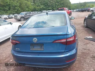2021 Volkswagen Jetta S z VIN 3VWC57BU6MM033172, wystawiony jako IAAI lot #42371654 z przebiegiem 38 488 mil mil oraz . Historia ofert i sprzedaży dostępna na DreamBid. Obrazek 16.