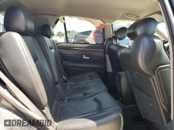 2009 Cadillac SRX RWD z VIN 1GYEE637090151656, wystawiony jako Copart lot #56118155 z przebiegiem Nie podano mil oraz Szkoda całkowita • Salvage title. Historia ofert i sprzedaży dostępna na DreamBid. Obrazek 11.