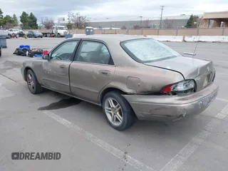 1999 Mazda 626 ES with VIN 1YVGF22C8X5900510, listed as a IAAI auction lot 41479213 with 178,182 mi miles. Bid and sale history available at carsss.com. Image 3.