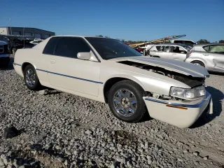 2000 Cadillac Eldorado z VIN 1G6EL12Y5YU176121, wystawiony jako Copart lot #77123914 z przebiegiem 91 663 mil mil oraz Szkoda całkowita • Salvage title. Historia ofert i sprzedaży dostępna na DreamBid. Obrazek 4.
