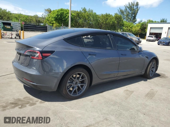 2023 Tesla Model 3 with VIN 5YJ3E1EA8PF704349, listed as a Copart auction lot 60220665 with 18,873 mi miles and Non repairable. Bid and sale history available at DreamBid. Image 3.
