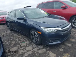 2018 Honda Civic EX-L z VIN JHMFC1F71JX018526, wystawiony jako IAAI lot #42204304 z przebiegiem 134 605 mil mil oraz . Historia ofert i sprzedaży dostępna na DreamBid. Obrazek 1.