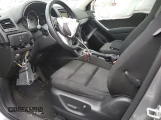 2014 Mazda CX-5 Touring z VIN JM3KE4CYXE0426408, wystawiony jako Copart lot #57355115 z przebiegiem Nie podano mil oraz Szkody całkowita. Historia ofert i sprzedaży dostępna na DreamBid. Obrazek 7.