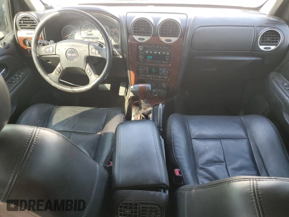 2005 GMC Envoy SLT with VIN 1GKDS13S952382088, listed as a Copart auction lot 64765154 with 177,333 mi miles and Salvage Title. Bid and sale history available at carsss.com. Image 8.