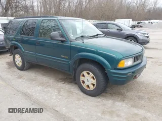 1997 Oldsmobile Bravada z VIN 1GHDT13W2V2706505, wystawiony jako IAAI lot #41835475 z przebiegiem 131 247 mil mil oraz . Historia ofert i sprzedaży dostępna na DreamBid. Obrazek 1.