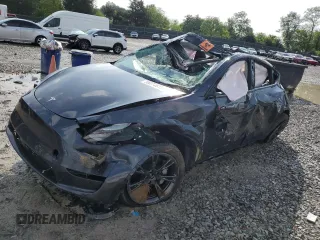 2024 Tesla Model Y Long Range with VIN 7SAYGDEEXRA324517, listed as a Copart auction lot 55274615 with Not provided miles and Salvage title. Bid and sale history available at DreamBid. Image 1.