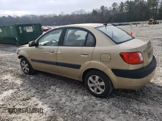 2009 Kia Rio LX with VIN KNADE223296470687, listed as a Copart auction lot 48385925 with 176,400 mi miles and Salvage Title. Bid and sale history available at DreamBid. Image 2.