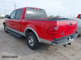 2002 Ford F-150 XLT with VIN 1FTRW07L82KE35460, listed as a IAAI auction lot 41243290 with 168,385 mi miles. Bid and sale history available at carsss.com. Image 3.