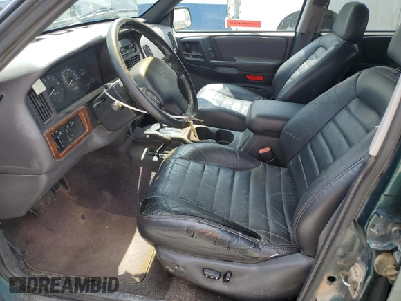 1996 Jeep Grand Cherokee Laredo z VIN 1J4GZ58S8TC222435, wystawiony jako Copart lot #62347665 z przebiegiem 202 125 mil mil oraz Czysty tytuł • Clean title. Historia ofert i sprzedaży dostępna na DreamBid. Obrazek 7.