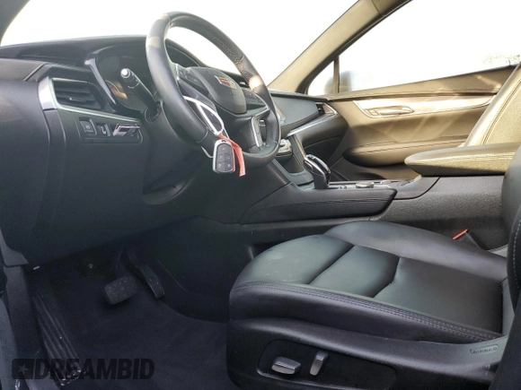 2022 Cadillac XT5 FWD Luxury z VIN 1GYKNAR47NZ100986, wystawiony jako Copart lot #83144574 z przebiegiem Nie podano mil oraz Nie do naprawy • Non repairable. Historia ofert i sprzedaży dostępna na DreamBid. Obrazek 7.