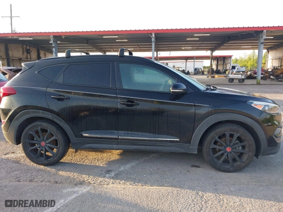 2017 Hyundai Tucson Value with VIN KM8J33A2XHU462806, listed as a IAAI auction lot 42045963 with 102,678 mi miles. Bid and sale history available at carsss.com. Image 13.