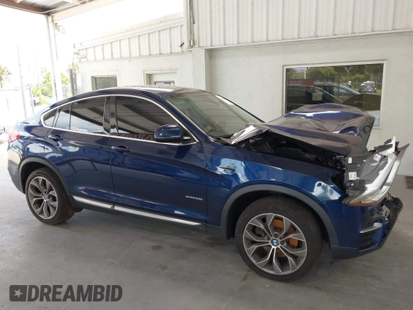 2015 BMW X4 xDrive28i with VIN 5UXXW3C51F0M87268, listed as a IAAI auction lot 42366363 with 143,285 mi miles and . Bid and sale history available at DreamBid. Image 14.
