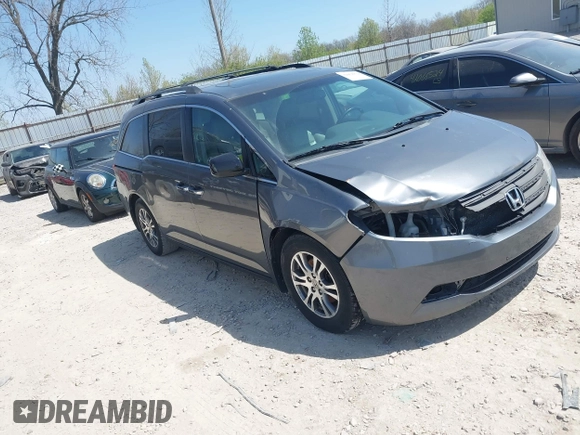2012 Honda Odyssey EX-L with VIN 5FNRL5H69CB047425, listed as a IAAI auction lot 42064979 with 242,409 mi miles and . Bid and sale history available at carsss.com. Image 1.