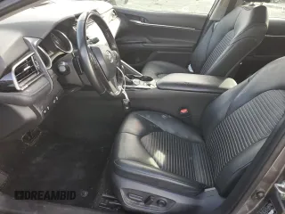2019 Toyota Camry Hybrid LE z VIN 4T1B21HKXKU518106, wystawiony jako Copart lot #77074883 z przebiegiem 147 442 mil mil oraz Szkoda całkowita • Salvage title. Historia ofert i sprzedaży dostępna na DreamBid. Obrazek 7.