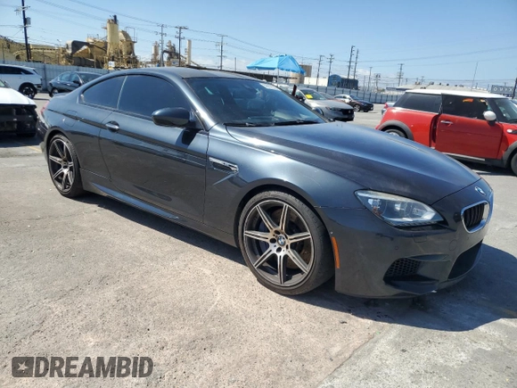 2015 BMW M6 z VIN WBSLX9C58FD160609, wystawiony jako Copart lot #56992535 z przebiegiem 52 324 mil mil oraz Tytuł czysty. Historia ofert i sprzedaży dostępna na DreamBid. Obrazek 4.