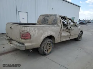 2001 Ford F-150 SuperCrew XLT with VIN 1FTRW07W01KA40634, listed as a Copart auction lot 71674184 with 0 mi miles and Salvage Title. Bid and sale history available at carsss.com. Image 3.