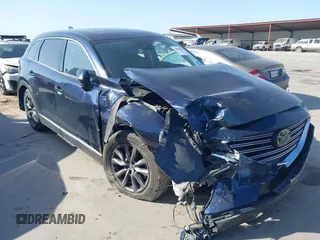 2020 Mazda CX-9 Touring z VIN JM3TCBCY5L0418213, wystawiony jako IAAI lot #42008998 z przebiegiem 59 813 mil mil oraz . Historia ofert i sprzedaży dostępna na DreamBid. Obrazek 1.
