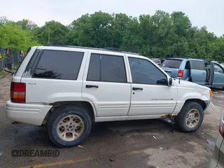 1997 Jeep Grand Cherokee Limited z VIN 1J4GZ78S1VC536295, wystawiony jako IAAI lot #42435292 z przebiegiem 310 005 mil mil oraz . Historia ofert i sprzedaży dostępna na DreamBid. Obrazek 14.