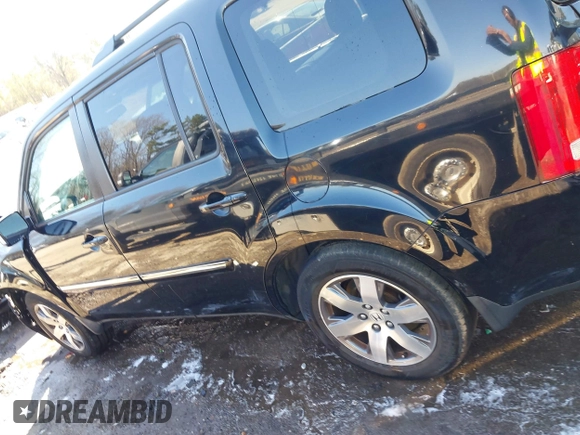 2015 Honda Pilot Touring with VIN 5FNYF3H97FB016390, listed as a IAAI auction lot 41753590 with 217,156 mi miles. Bid and sale history available at carsss.com. Image 14.