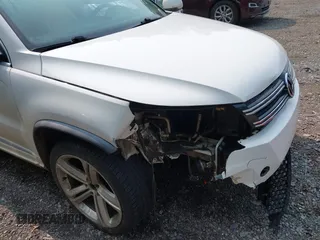 2014 Volkswagen Tiguan SEL with VIN WVGAV3AX7EW022239, listed as a IAAI auction lot 42381670 with 180,729 mi miles and . Bid and sale history available at DreamBid. Image 6.