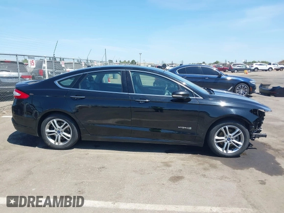 2016 Ford Fusion Titanium Hybrid z VIN 3FA6P0RUXGR123445, wystawiony jako IAAI lot #42606596 z przebiegiem 145 541 mil mil oraz . Historia ofert i sprzedaży dostępna na DreamBid. Obrazek 14.