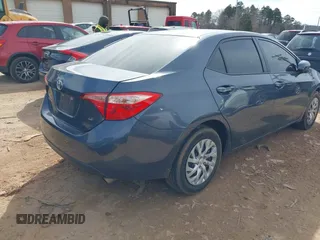 2018 Toyota Corolla L with VIN 5YFBURHE8JP807522, listed as a IAAI auction lot 41609439 with 76,573 mi miles and . Bid and sale history available at DreamBid. Image 4.