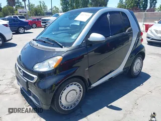 2013 Smart fortwo Pure с VIN WMEEJ3BA6DK676071, выставлен на аукционе IAAI как лот 42677618 с пробегом 191 709 миль миль и . История ставок и продаж доступна на DreamBid. Изображение 2.