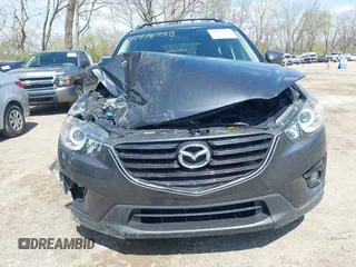 2016 Mazda CX-5 Touring with VIN JM3KE4CYXG0620990, listed as a IAAI auction lot 41978738 with 91,237 mi miles and . Bid and sale history available at carsss.com. Image 12.