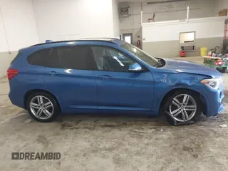 2019 BMW X1 xDrive28i with VIN WBXHT3C53K5L36690, listed as a IAAI auction lot 42012992 with 70,339 mi miles. Bid and sale history available at carsss.com. Image 13.