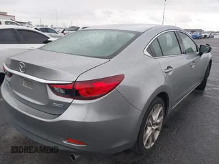2014 Mazda 6 i Touring with VIN JM1GJ1V60E1141831, listed as a IAAI auction lot 42131200 with 86,597 mi miles and . Bid and sale history available at DreamBid. Image 4.