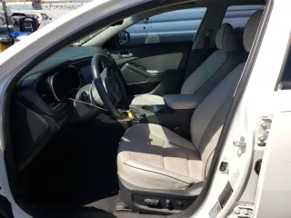 2016 Kia Optima Hybrid EX with VIN KNAGN4AD7G5097975, listed as a Copart auction lot 68545594 with 170,521 mi miles and Clean Title. Bid and sale history available at carsss.com. Image 7.