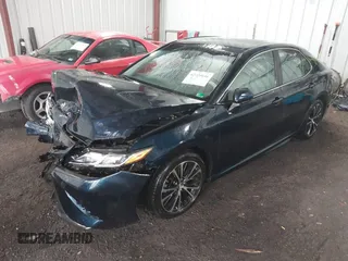 2018 Toyota Camry LE z VIN 4T1B11HK8JU517019, wystawiony jako IAAI lot #42220646 z przebiegiem 98 924 mil mil oraz . Historia ofert i sprzedaży dostępna na DreamBid. Obrazek 16.