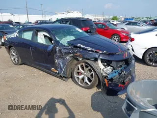 2015 Dodge Charger Road/Track z VIN 2C3CDXCT5FH820017, wystawiony jako IAAI lot #42410216 z przebiegiem 125 501 mil mil oraz . Historia ofert i sprzedaży dostępna na DreamBid. Obrazek 1.